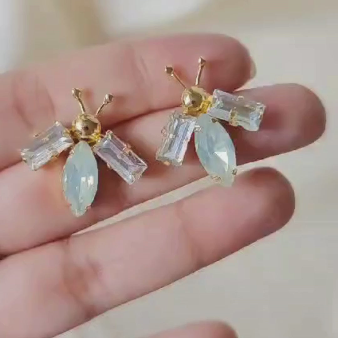 White and opal gold bug ear studs with brass, faux opal navette center and 18K rhodium gold finish